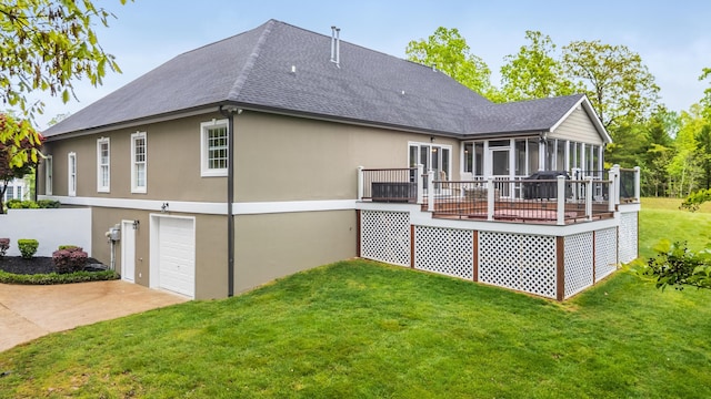rear view of property featuring a deck, stucco siding, a shingled roof, a garage, and a sunroom