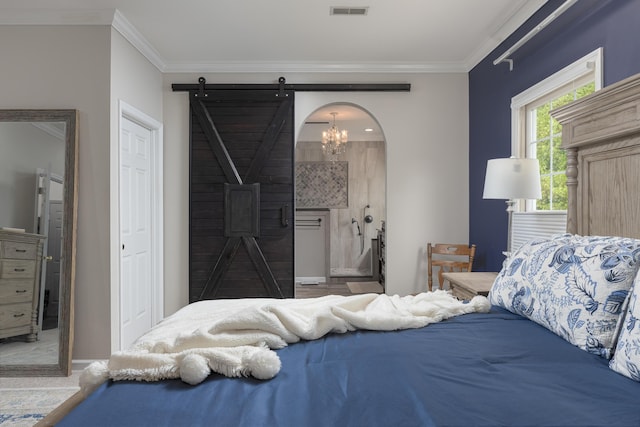 carpeted bedroom featuring a chandelier, a barn door, crown molding, visible vents, and baseboards