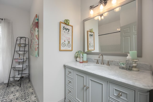 bathroom featuring a shower with curtain, tile patterned floors, vanity, and baseboards