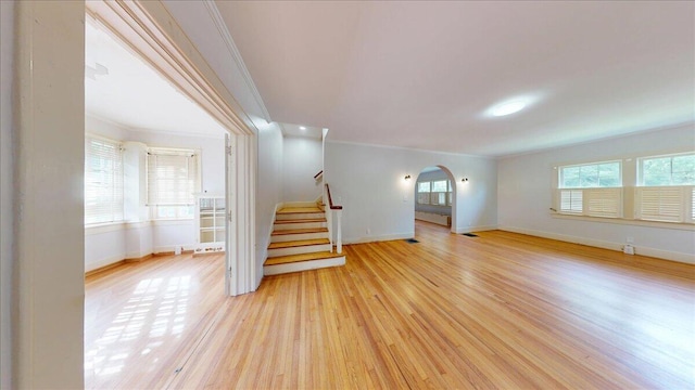 159 Gardner St, Chattanooga, TN 37411 - unfurnished living room featuring crown molding, baseboards, light wood-type flooring, and stairs
