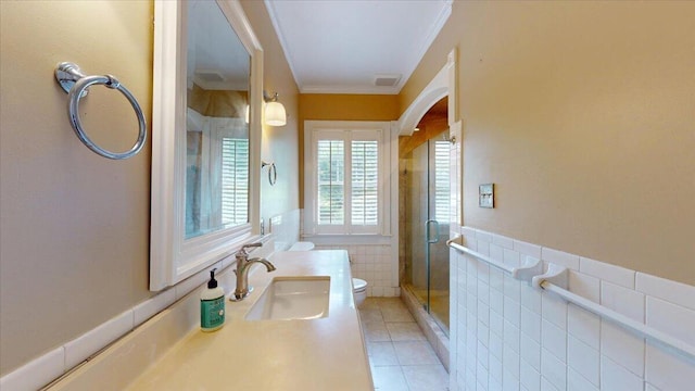 159 Gardner St, Chattanooga, TN 37411 - bathroom featuring crown molding, tile walls, tile patterned flooring, a stall shower, and toilet