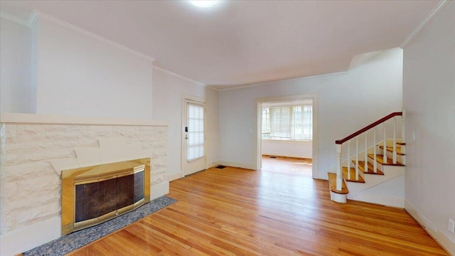 159 Gardner St, Chattanooga, TN 37411 - unfurnished living room featuring a fireplace, wood finished floors, baseboards, ornamental molding, and stairs