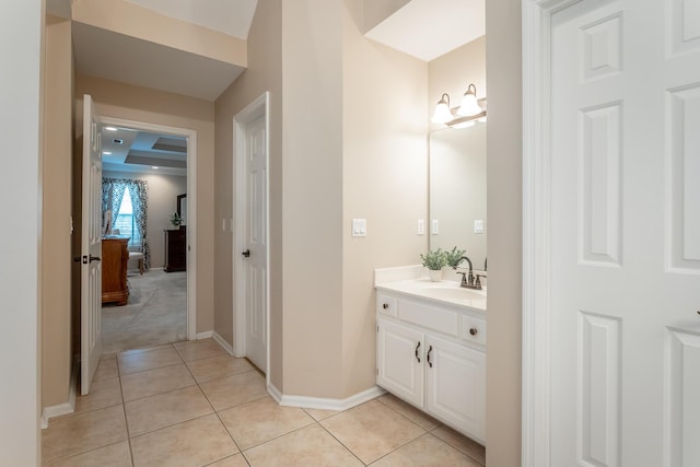 bathroom featuring vanity, baseboards, and tile patterned floors