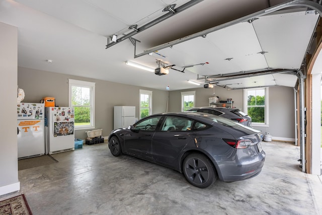 2419 Welch Rd, Soddy Daisy, TN 37379 - garage with a garage door opener and freestanding refrigerator