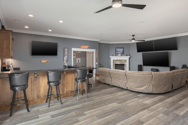 2419 Welch Rd, Soddy Daisy, TN 37379 - living area with ceiling fan, a fireplace, light wood finished floors, ornamental molding, and recessed lighting