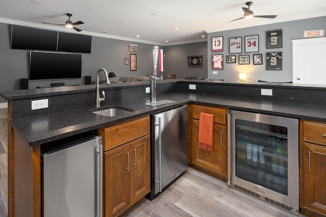 2419 Welch Rd, Soddy Daisy, TN 37379 - bar with beverage cooler, a sink, a ceiling fan, and freestanding refrigerator