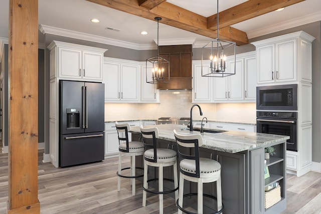 2419 Welch Rd, Soddy Daisy, TN 37379 - kitchen featuring light wood-style flooring, a sink, black appliances, a chandelier, and white cabinetry