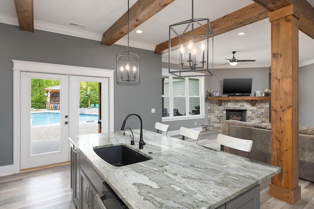 2419 Welch Rd, Soddy Daisy, TN 37379 - kitchen with visible vents, beam ceiling, a sink, light wood finished floors, and ornamental molding