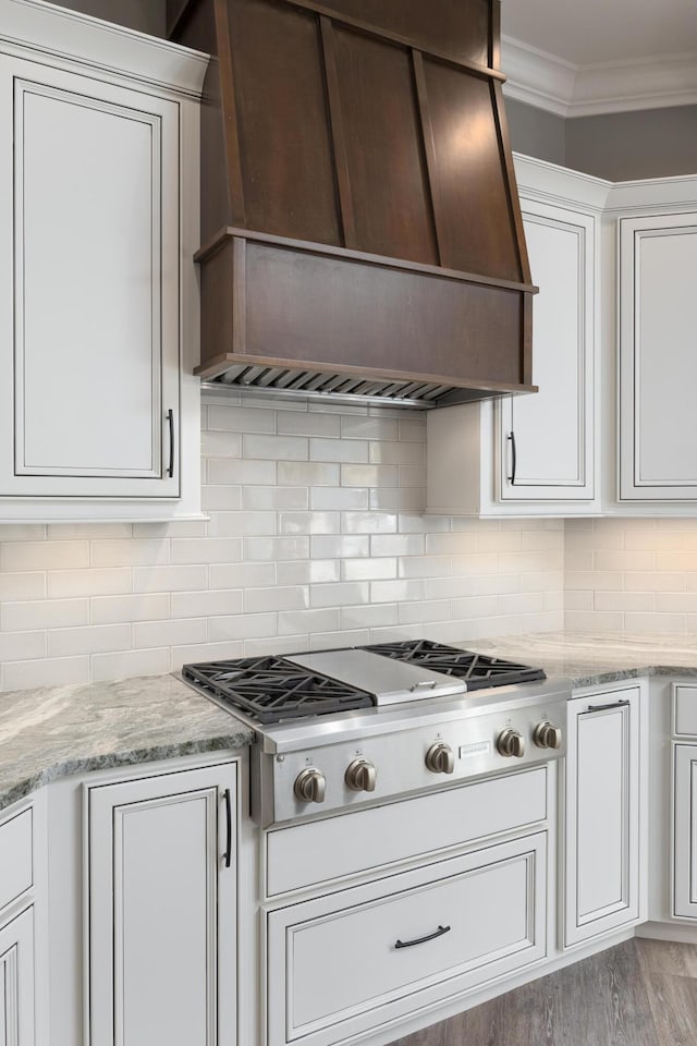 2419 Welch Rd, Soddy Daisy, TN 37379 - kitchen with backsplash, ornamental molding, stainless steel gas cooktop, and custom exhaust hood