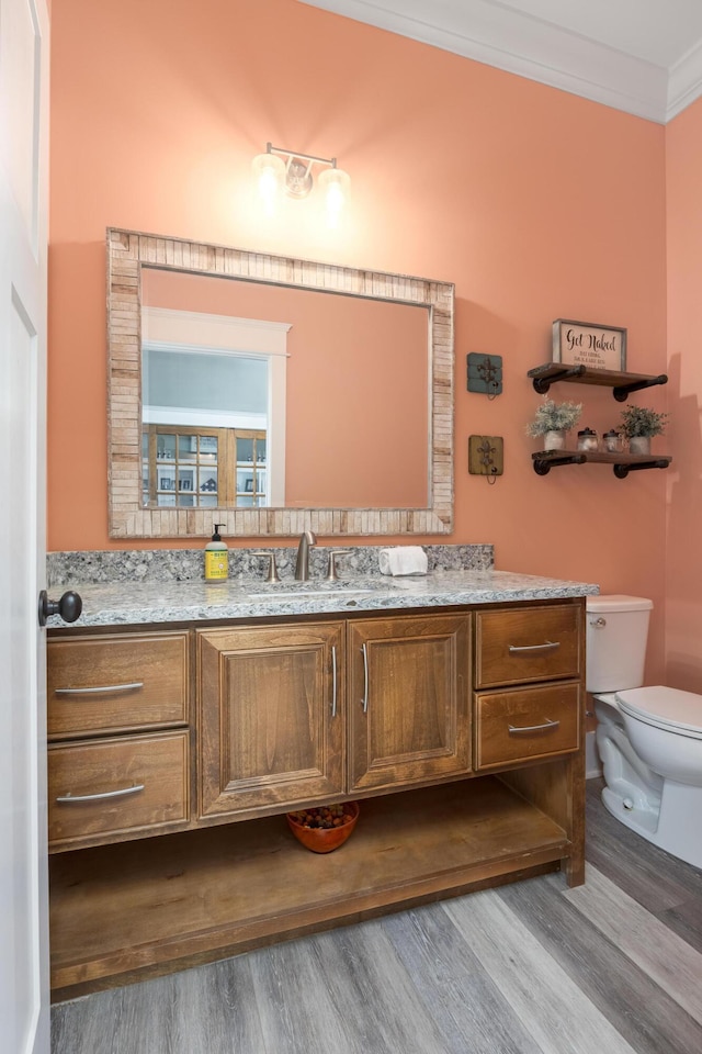 2419 Welch Rd, Soddy Daisy, TN 37379 - bathroom with vanity, ornamental molding, toilet, and wood finished floors