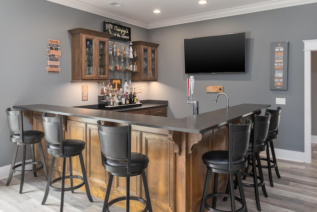 2419 Welch Rd, Soddy Daisy, TN 37379 - bar featuring baseboards, indoor wet bar, light wood-style floors, ornamental molding, and recessed lighting