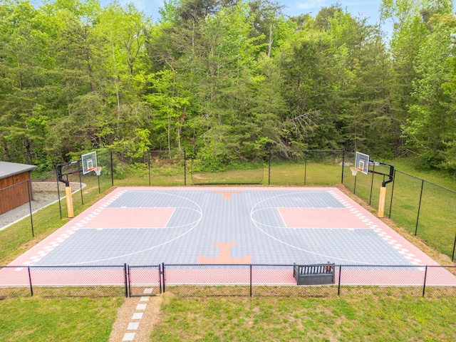 2419 Welch Rd, Soddy Daisy, TN 37379 - view of sport court featuring a lawn, fence, and basketball hoop