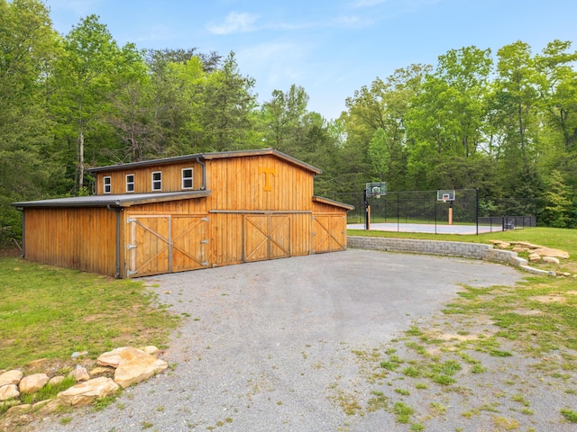 2419 Welch Rd, Soddy Daisy, TN 37379 - view of barn with a view of trees, fence, and gravel driveway