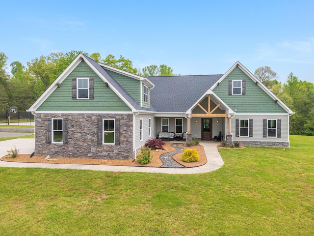 2419 Welch Rd, Soddy Daisy, TN 37379 - craftsman-style home with a front yard, a porch, and stone siding
