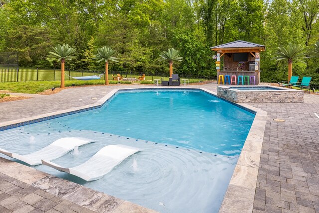 2419 Welch Rd, Soddy Daisy, TN 37379 - view of swimming pool featuring fence, a patio, a gazebo, and a pool with connected hot tub