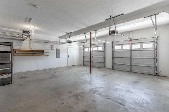 garage featuring a garage door opener and electric panel