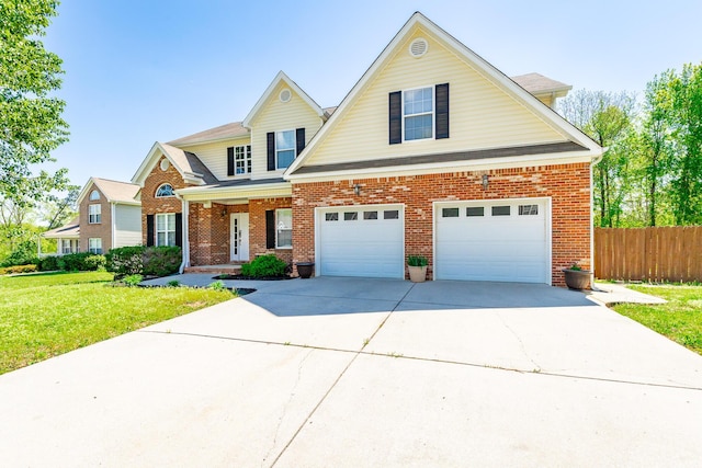 view of front of house featuring a front lawn, a garage, driveway, brick siding, and fence