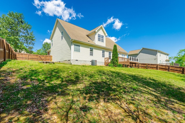 back of house with a lawn, a fenced backyard, cooling unit, and crawl space