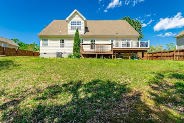 back of property featuring a deck, a fenced backyard, central AC unit, crawl space, and a lawn