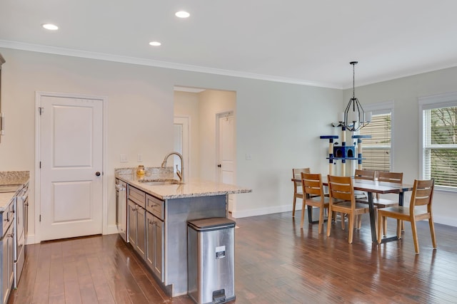 2835 Fernleaf Ln, Chattanooga, TN 37421 - kitchen with dark wood-style flooring, a peninsula, light stone countertops, baseboards, and a sink