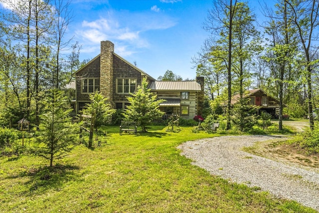1011 Buffalo Rd, Jefferson City, TN 37760 - exterior space featuring a standing seam roof, metal roof, a yard, a chimney, and gravel driveway