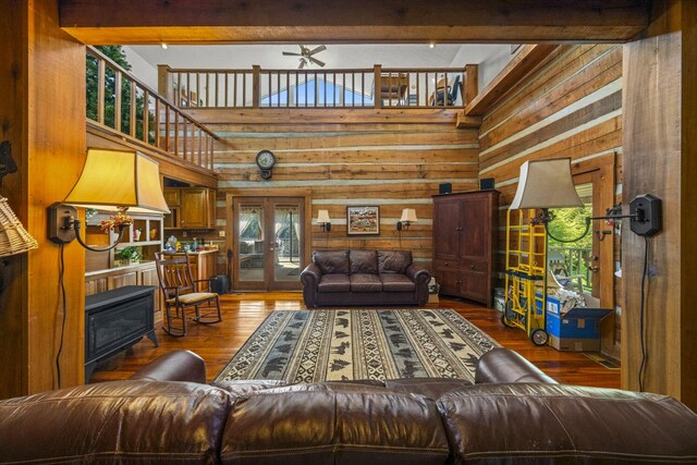 1011 Buffalo Rd, Jefferson City, TN 37760 - living area featuring hardwood / wood-style flooring, wood walls, ceiling fan, french doors, and a towering ceiling