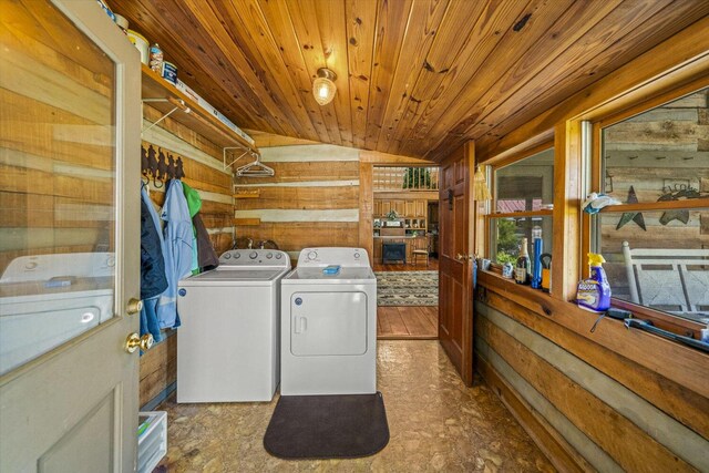 1011 Buffalo Rd, Jefferson City, TN 37760 - laundry area featuring wood ceiling, wooden walls, washer and dryer, and laundry area
