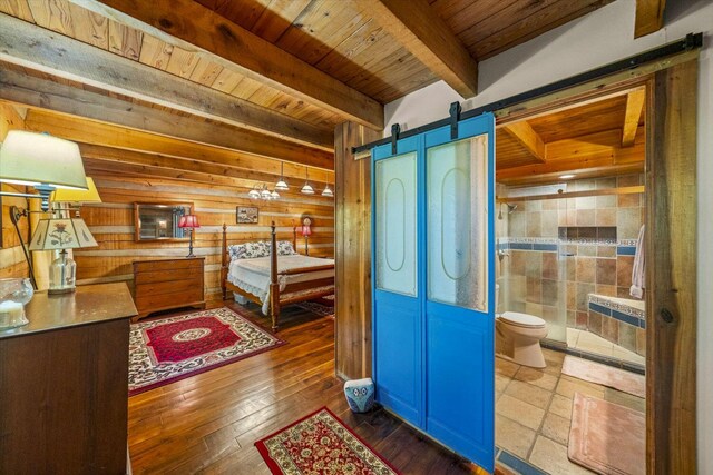 1011 Buffalo Rd, Jefferson City, TN 37760 - bedroom with a barn door, beamed ceiling, wood-type flooring, and wood ceiling