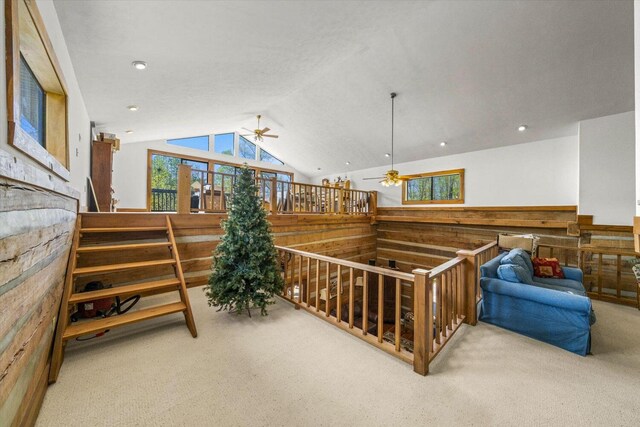 1011 Buffalo Rd, Jefferson City, TN 37760 - interior space featuring wood walls, a ceiling fan, carpet flooring, and vaulted ceiling