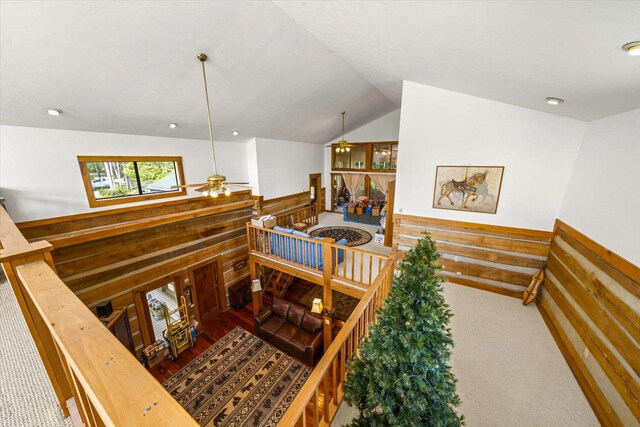 1011 Buffalo Rd, Jefferson City, TN 37760 - staircase with carpet floors, wood walls, a wainscoted wall, a ceiling fan, and lofted ceiling