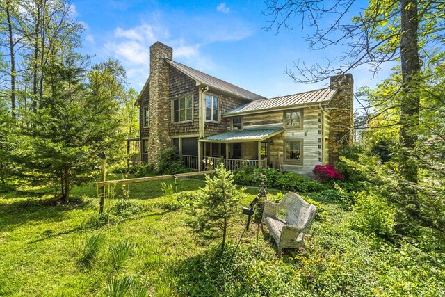 1011 Buffalo Rd, Jefferson City, TN 37760 - back of property featuring metal roof, a standing seam roof, and a chimney