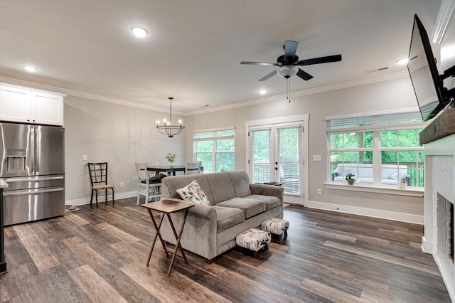 4130 Inlet Loop, Chattanooga, TN 37416 - living room with a fireplace, dark wood-style floors, a chandelier, ceiling fan, and crown molding