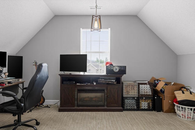 carpeted office space featuring visible vents, a textured ceiling, and vaulted ceiling