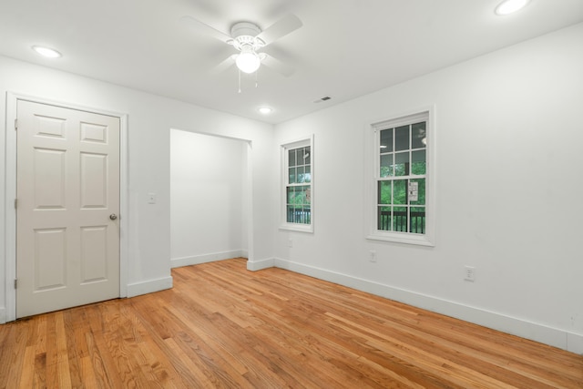 empty room featuring recessed lighting, ceiling fan, baseboards, and light wood-style floors