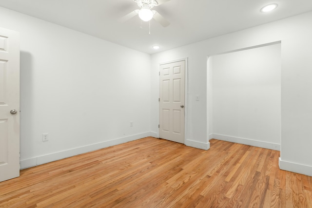 spare room with recessed lighting, ceiling fan, baseboards, and light wood-type flooring