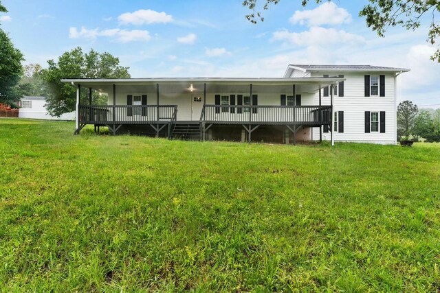 back of house featuring a yard