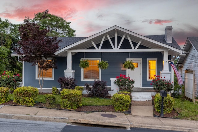 1310 Dallas Rd, Chattanooga, TN 37405 - view of front of home featuring covered porch, a chimney, and a shingled roof