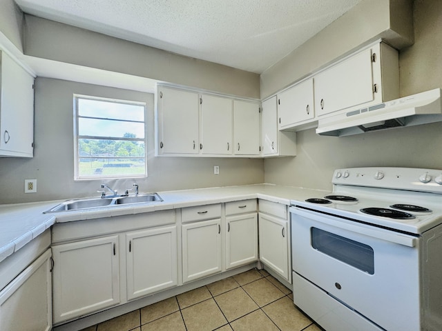 kitchen with under cabinet range hood, white cabinets, a sink, and white electric range