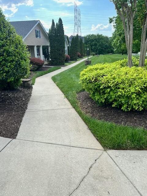 view of home's community with a yard