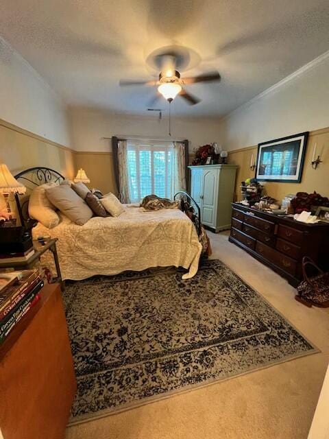 bedroom with ceiling fan and light colored carpet