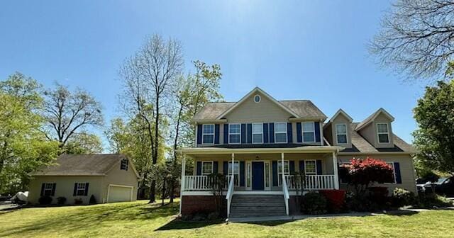 colonial-style house with a porch and a front lawn