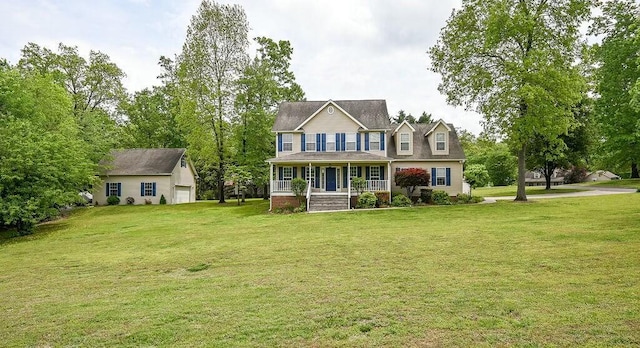 colonial home featuring a porch and a front yard