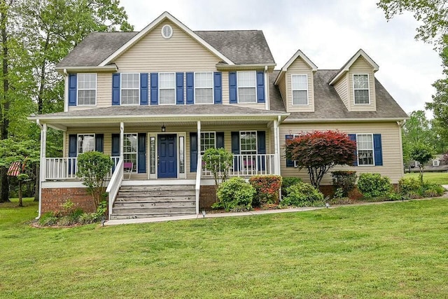 colonial home featuring a porch, a front lawn, and a shingled roof