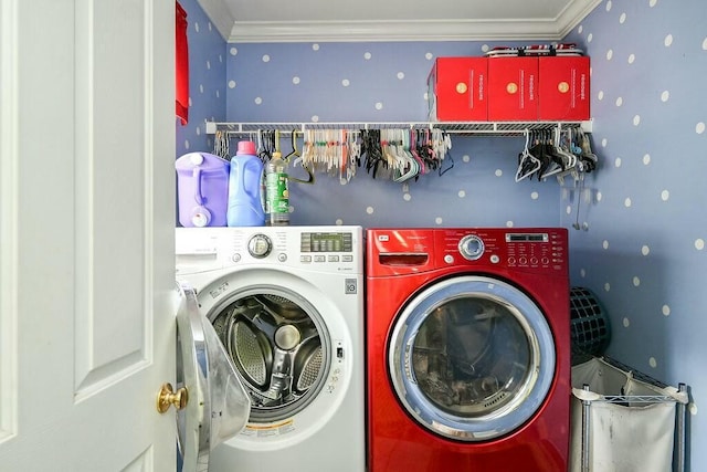 laundry room with wallpapered walls, ornamental molding, laundry area, and independent washer and dryer