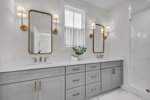 bathroom featuring double vanity, a tile shower, marble finish floor, and a sink