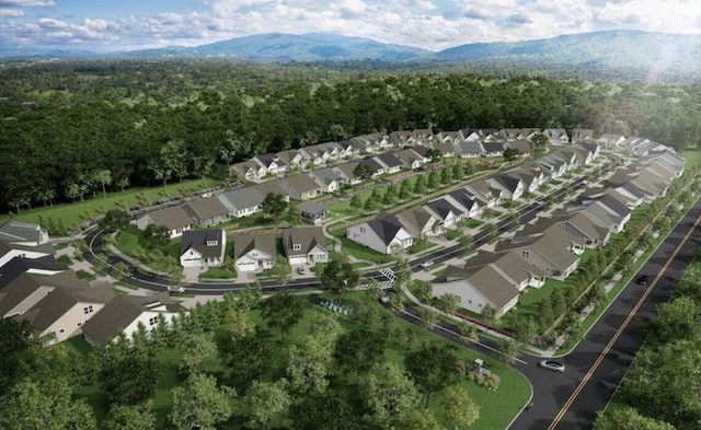birds eye view of property featuring a residential view, a mountain view, and a forest view