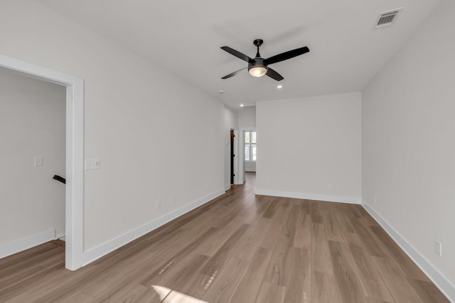 unfurnished room with recessed lighting, ceiling fan, visible vents, baseboards, and wood finished floors