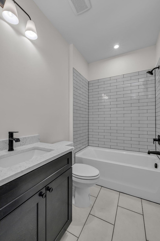 bathroom with washtub / shower combination, visible vents, and toilet