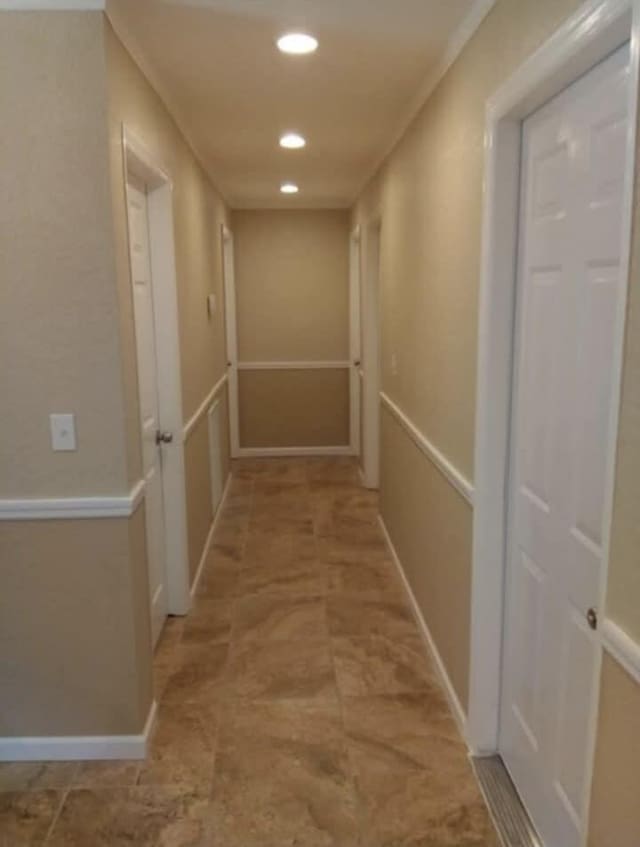 hall featuring recessed lighting
