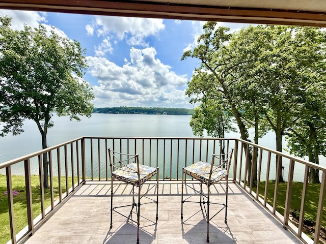 balcony featuring a water view